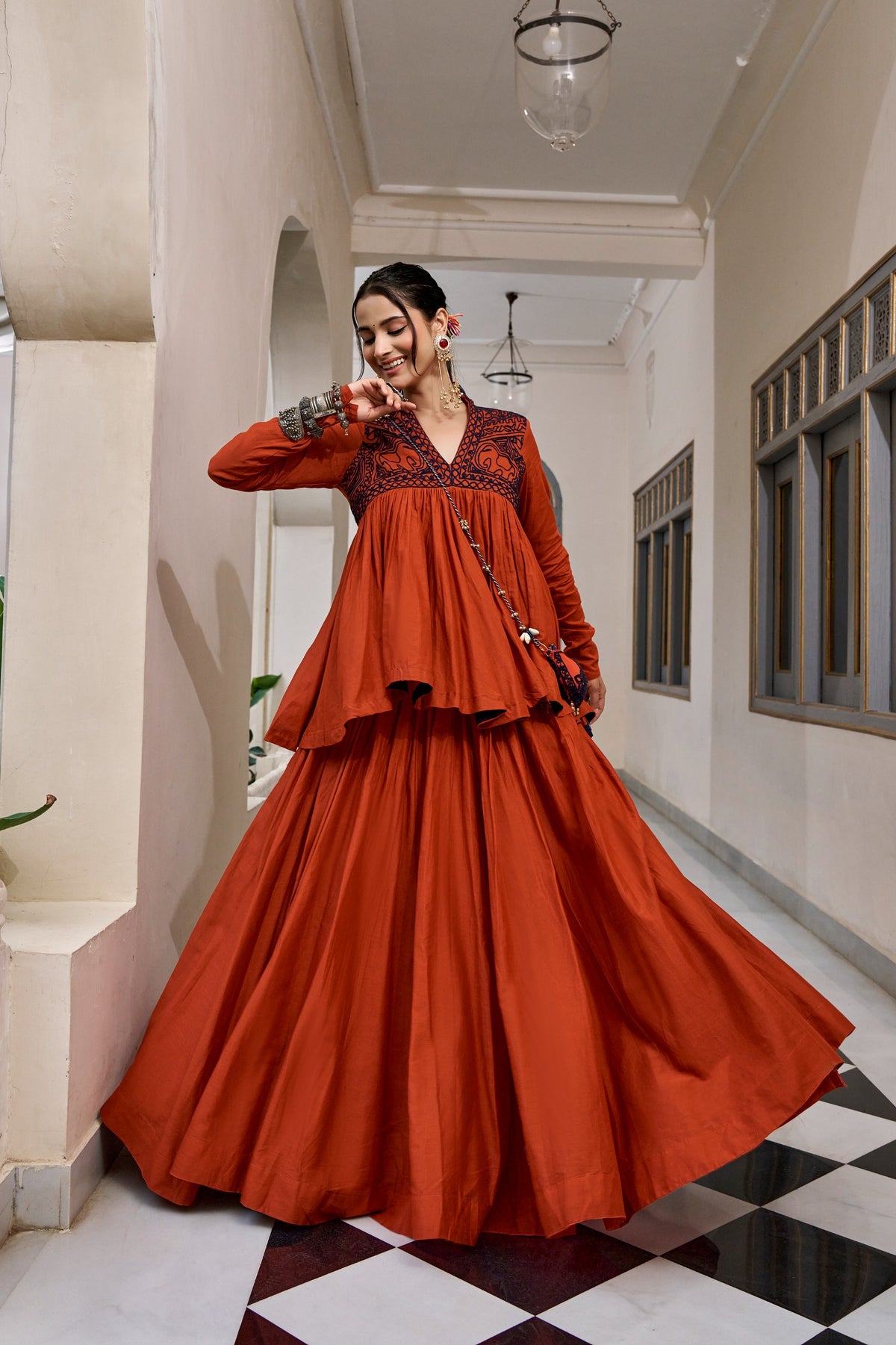 Designed for &nbsp;Pure Cotton, this graceful lehenga features intricate Kashida and gamthi Work on the top, paired with a charming matching Purse for a complete festive look.