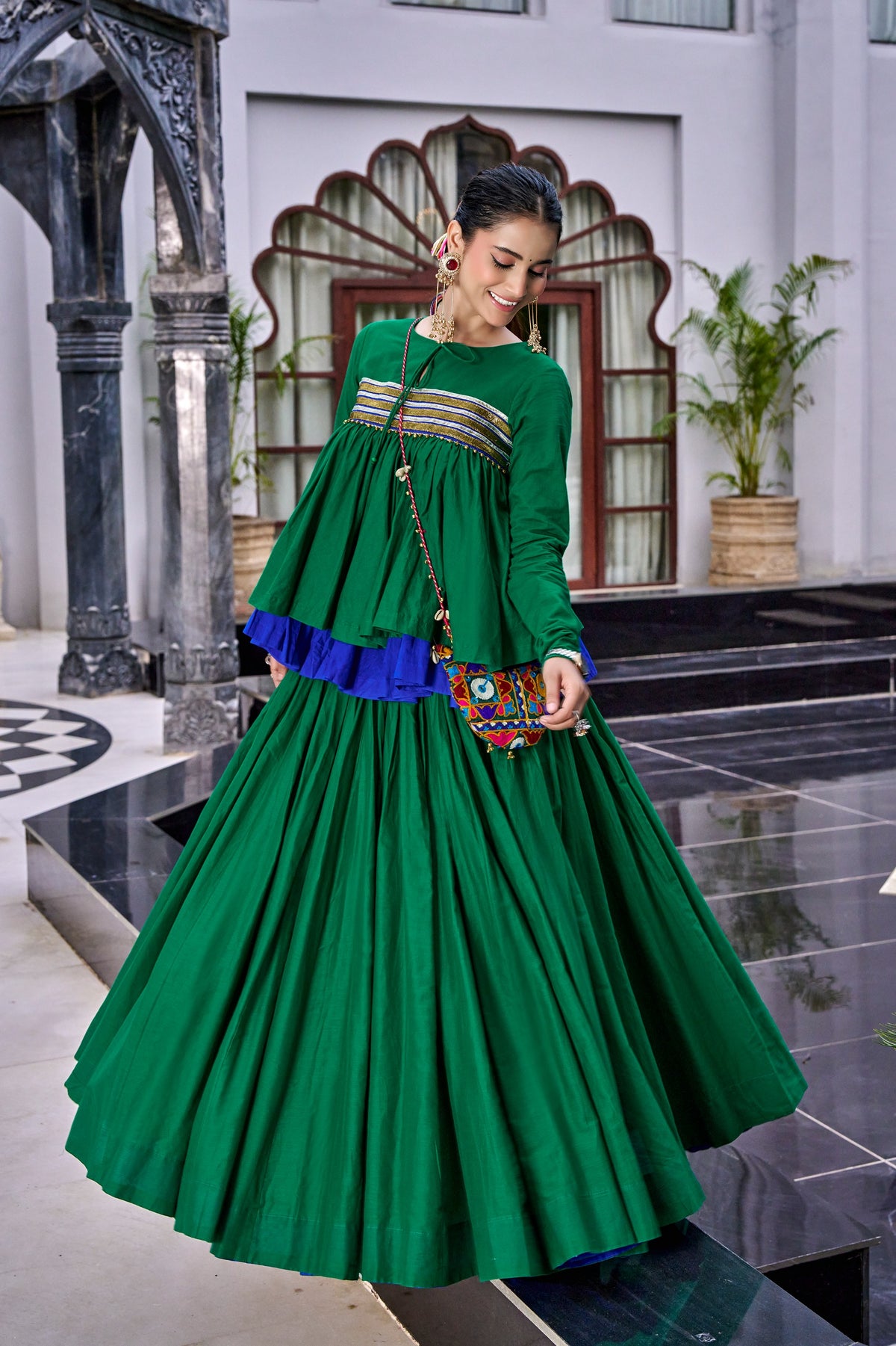 Designed for &nbsp;Pure Cotton, this graceful lehenga features intricate Kashida and gamthi Work on the top, paired with a charming matching Purse for a complete festive look.