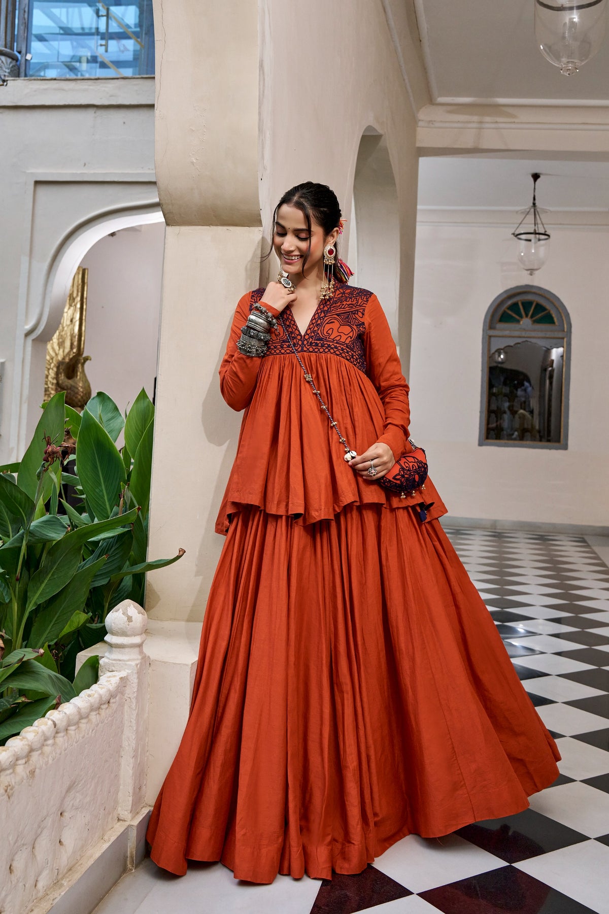 Designed for &nbsp;Pure Cotton, this graceful lehenga features intricate Kashida and gamthi Work on the top, paired with a charming matching Purse for a complete festive look.