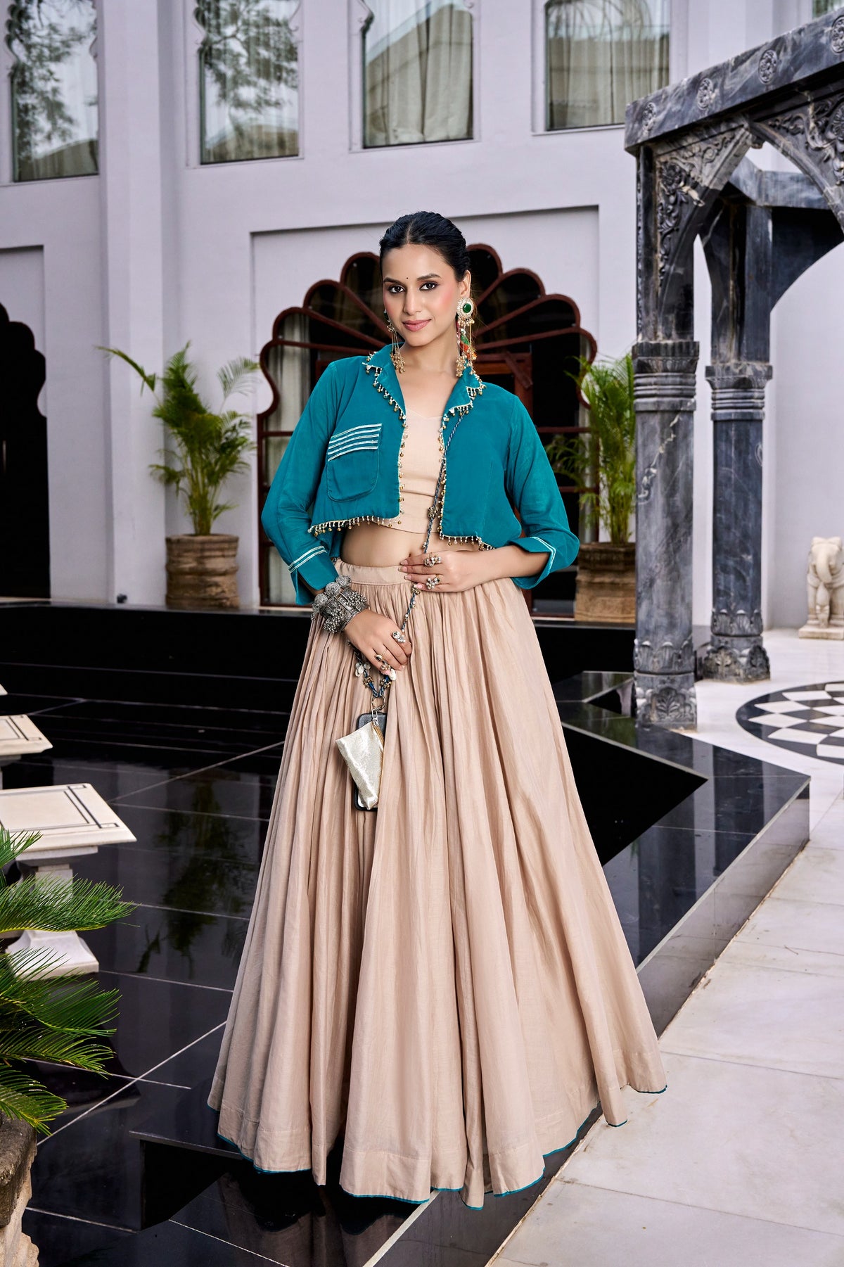 Designed for &nbsp;Pure Cotton, this graceful lehenga features intricate Kashida and gamthi Work on the top, paired with a charming matching Purse for a complete festive look.