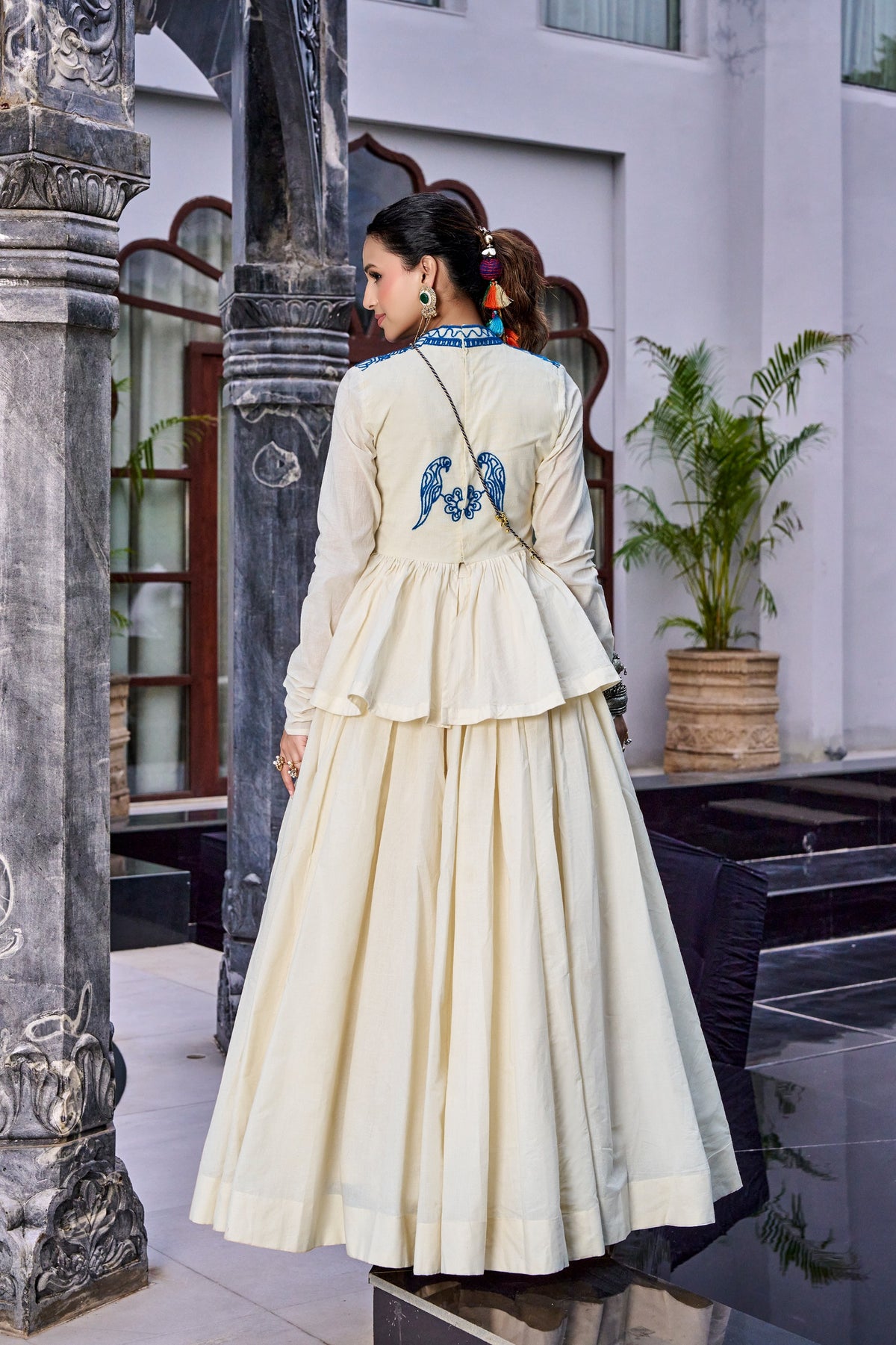 Designed for &nbsp;Pure Cotton, this graceful lehenga features intricate Kashida and gamthi Work on the top, paired with a charming matching Purse for a complete festive look.