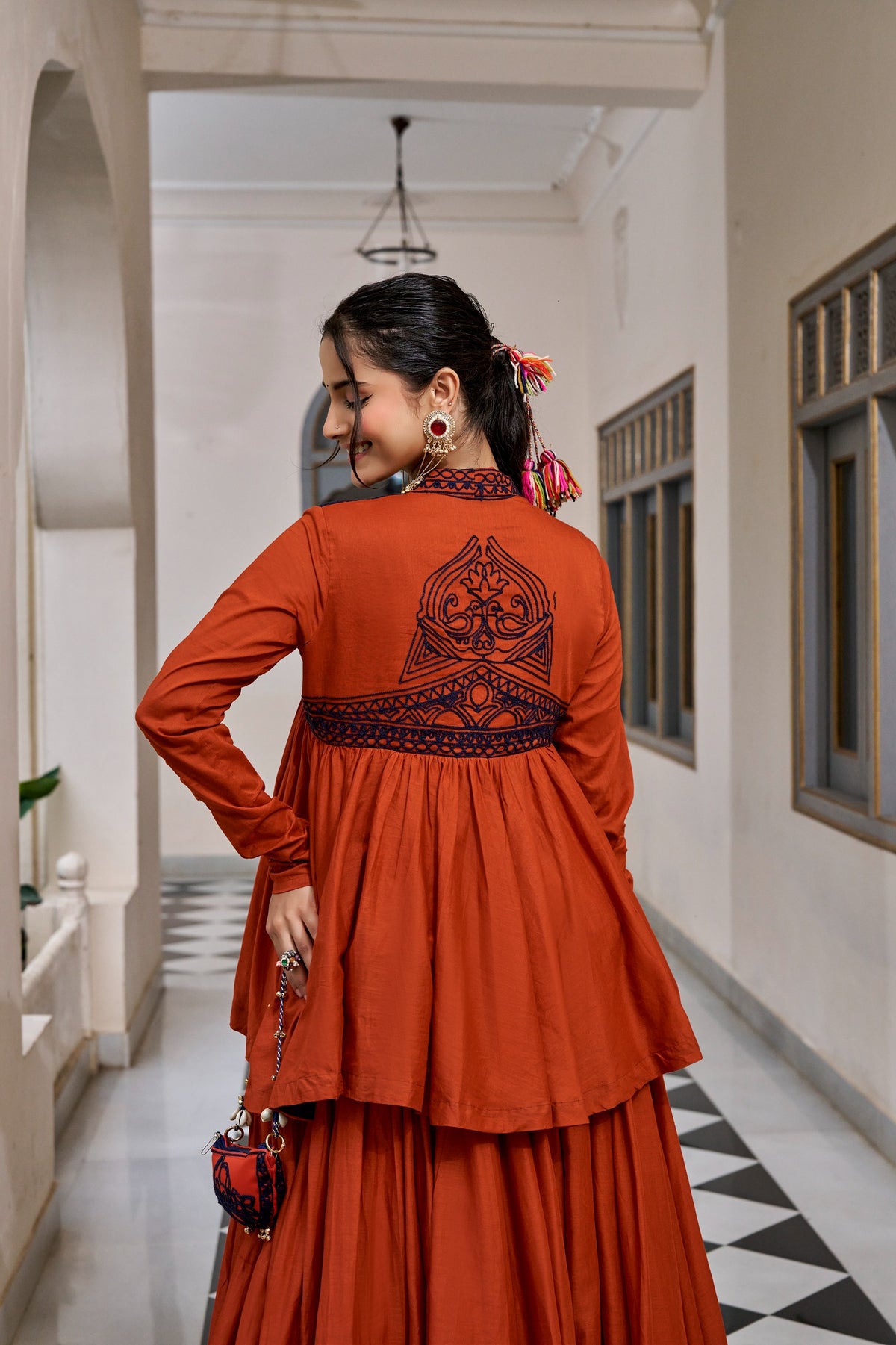 Designed for &nbsp;Pure Cotton, this graceful lehenga features intricate Kashida and gamthi Work on the top, paired with a charming matching Purse for a complete festive look.