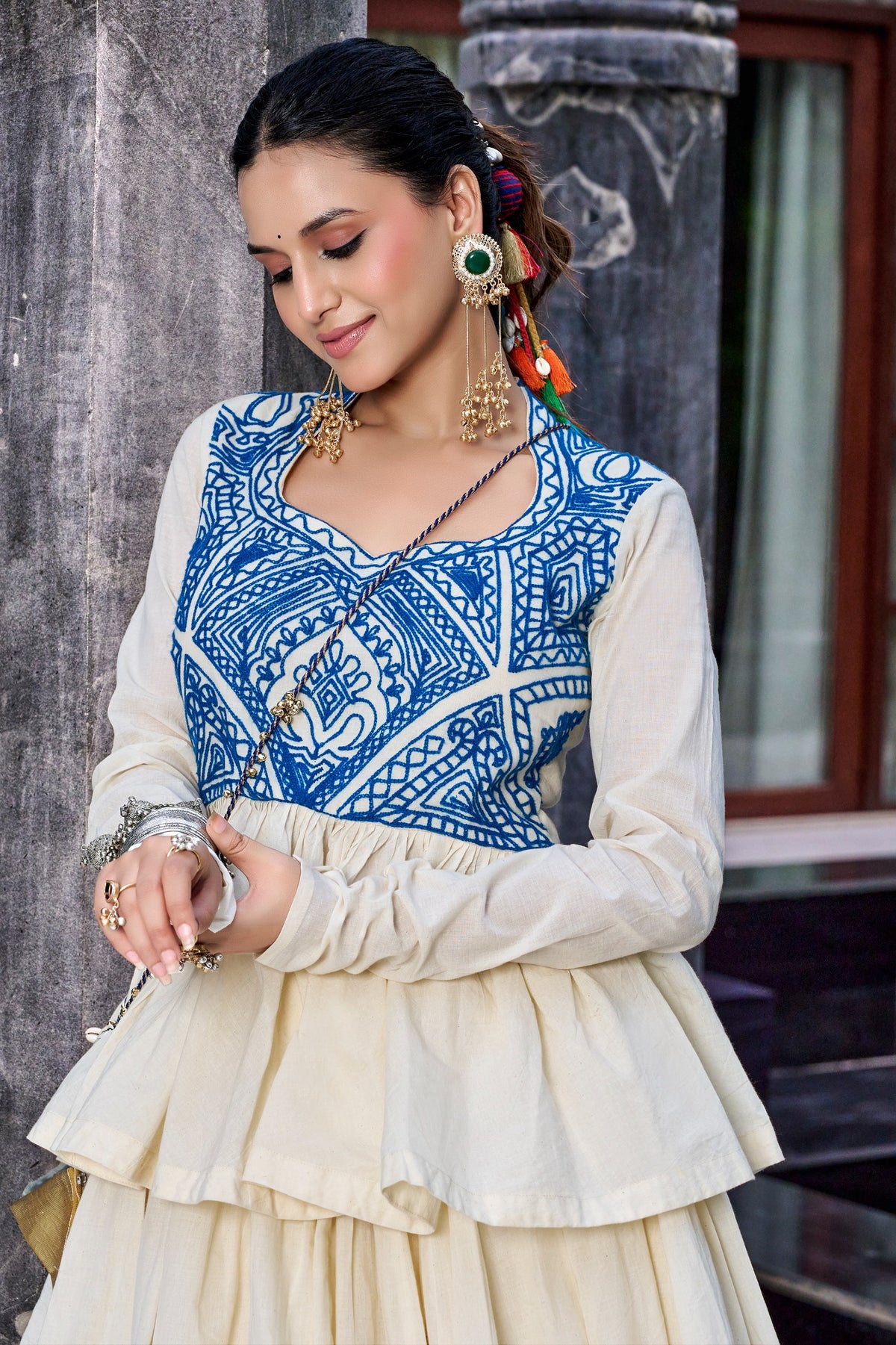 Designed for &nbsp;Pure Cotton, this graceful lehenga features intricate Kashida and gamthi Work on the top, paired with a charming matching Purse for a complete festive look.