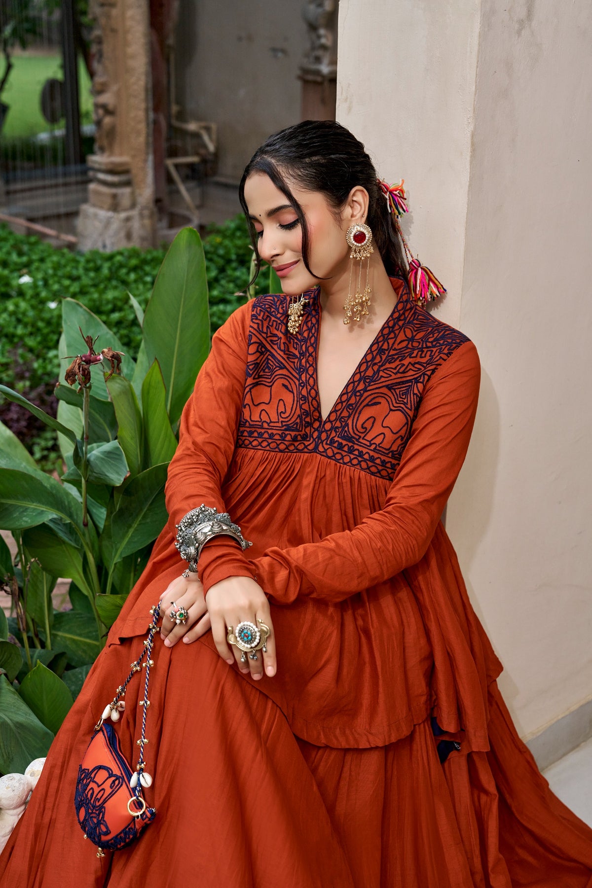 Designed for &nbsp;Pure Cotton, this graceful lehenga features intricate Kashida and gamthi Work on the top, paired with a charming matching Purse for a complete festive look.