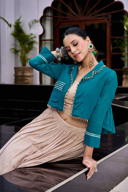 Designed for &nbsp;Pure Cotton, this graceful lehenga features intricate Kashida and gamthi Work on the top, paired with a charming matching Purse for a complete festive look.