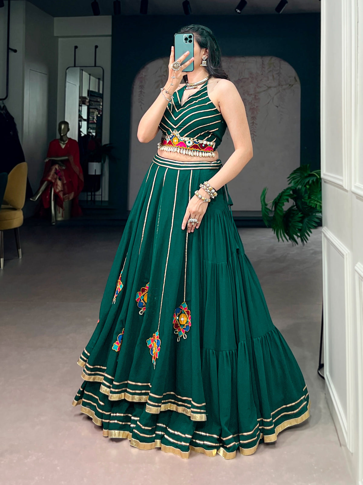 Lightweight fabric with vibrant Gamthi work, mirror detailing, Gotta Patti lace, and shell