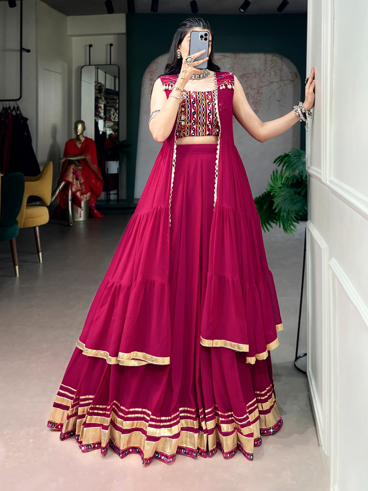 Raas Rani Collection Comfort with this lightweight lehenga, highlighted by a handcrafted Gamthi blouse, Gotta Patti lace detailing, and a mirror-adorned long koti. &nbsp;