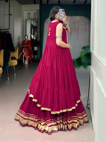 Raas Rani Collection Comfort with this lightweight lehenga, highlighted by a handcrafted Gamthi blouse, Gotta Patti lace detailing, and a mirror-adorned long koti. &nbsp;