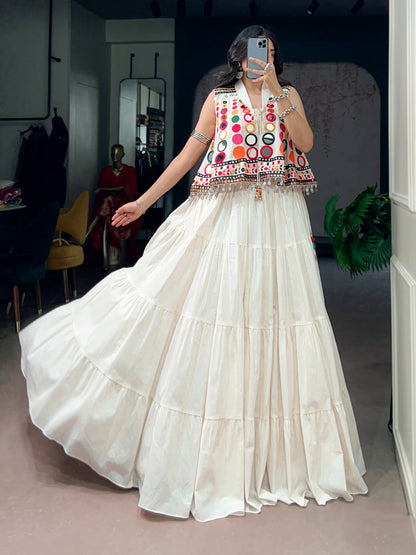 The sparkle of mirrors, a swirling lehenga, and the tunes of Garba—combined with traditional mirror-work detailing, these elements create a stunning festive look that looks beautiful for Navratri celebrations.