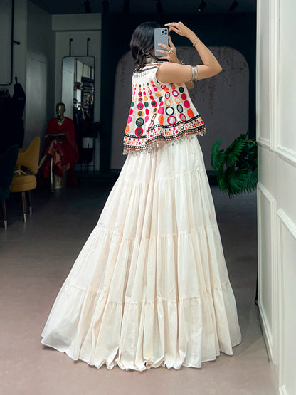 The sparkle of mirrors, a swirling lehenga, and the tunes of Garba—combined with traditional mirror-work detailing, these elements create a stunning festive look that looks beautiful for Navratri celebrations.