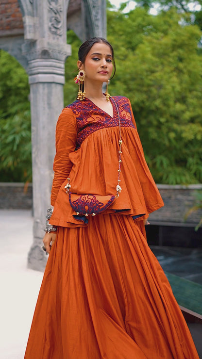 Designed for &nbsp;Pure Cotton, this graceful lehenga features intricate Kashida and gamthi Work on the top, paired with a charming matching Purse for a complete festive look.