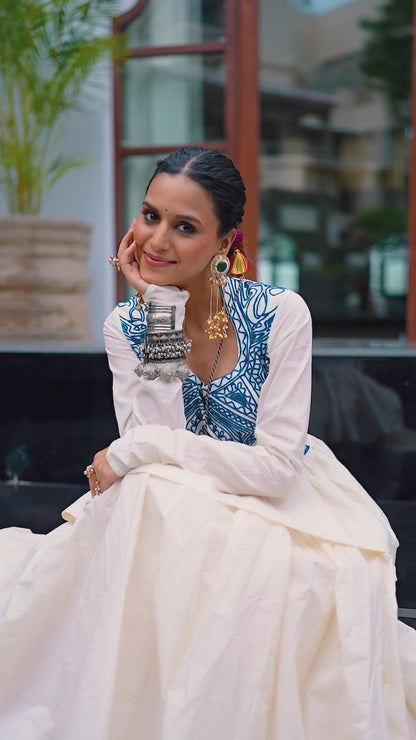 Designed for &nbsp;Pure Cotton, this graceful lehenga features intricate Kashida and gamthi Work on the top, paired with a charming matching Purse for a complete festive look.